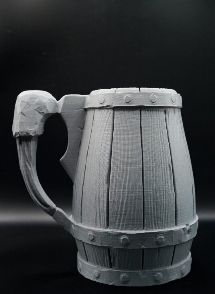 3D printed wood-barrel style tankard mug, angled view showing handle
