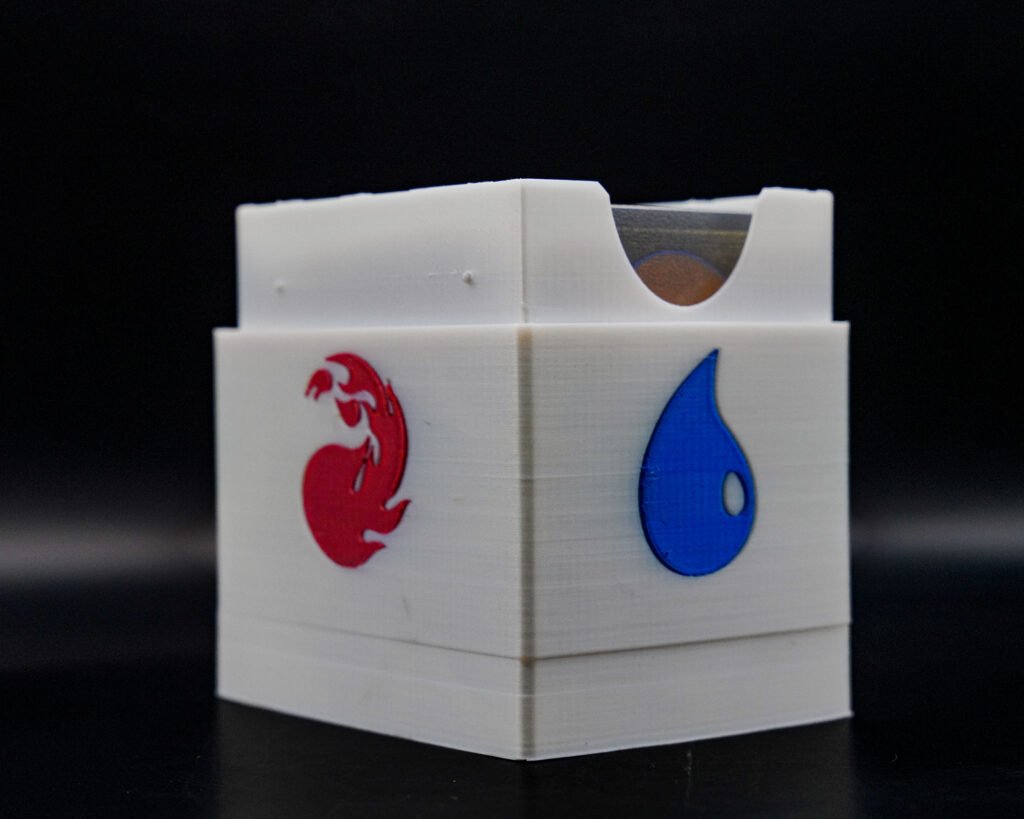3D printed Magic: The Gathering card box with fire and water elemental icons, holds up to 100 sleeved cards